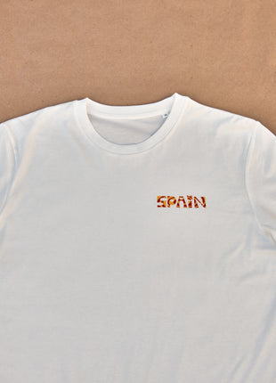 T-shirt Spain Unisex Medium Fit geometry twirlThis T-shirt features a unique "geometry twirl" design with the word "SPAIN" printed in the traditional colors of the Spanish flag: red and yellow. Made of 100% organic cotton, it is not only comfortable but a